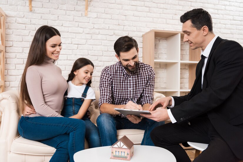 Family reviewing and signing a retirement income planning agreement with an insurance advisor