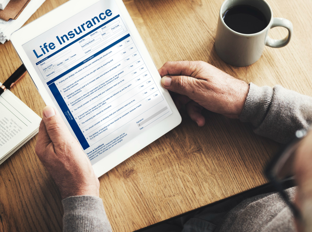 Person reviewing a life insurance policy document on a tablet at home in Brownwood, Texas